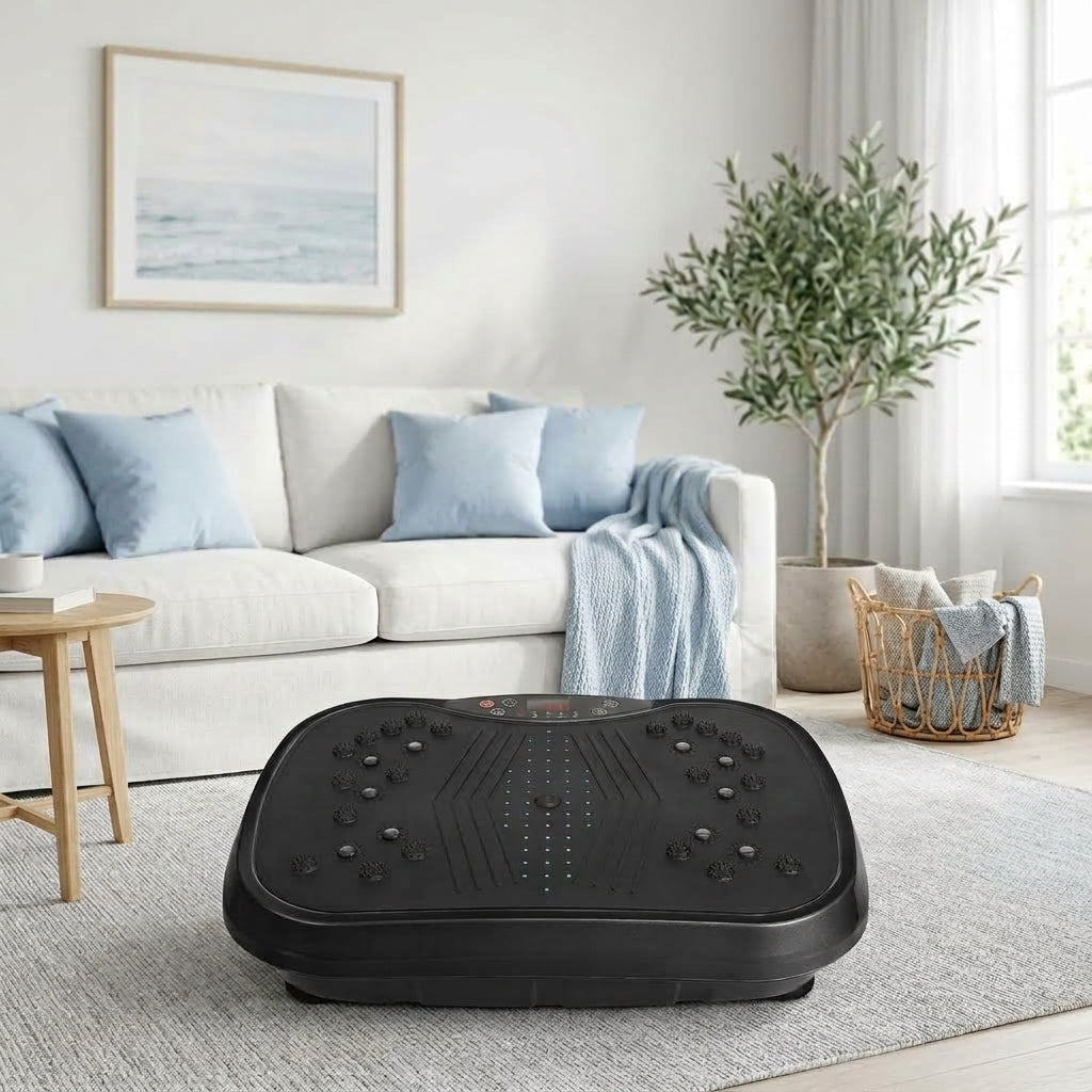 Drainaea Ripple vibration plate on a gray rug in front of a white sofa in a bright living room. – Your daily reset for tired legs..